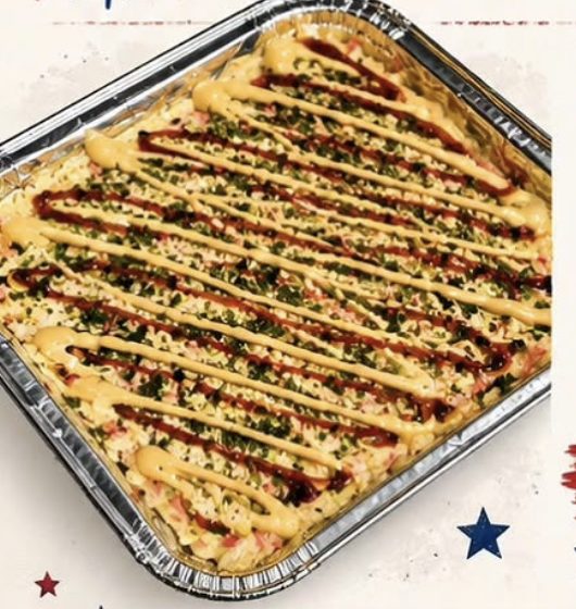 TAKAM sushi bake — 8x8 foil tray of layered sushi rice and seasoned topping, drizzled with sauces